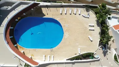 an overhead view of a large swimming pool at Albufeira, Blue Wave Retreat 65 in Albufeira
