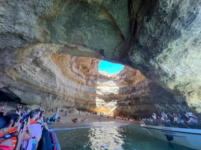 a group of people on a boat in a cave at Casa rooftop jacuzzi and magnificent sea view in Albufeira
