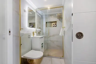 a bathroom with a shower and a sink at Jungle Flat with Pool T2 Montechoro in Albufeira