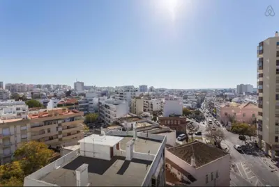 an aerial view of a city with buildings at Brigida's Flat in Faro