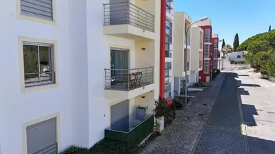 an empty street in an apartment building at Medronheira - Apt 1A by HelloVacations in Albufeira
