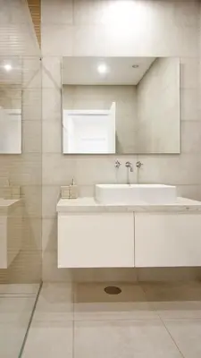 a white bathroom with a sink and a mirror at Orange Boutique Residence - Casa Farol Adults Only in Quarteira