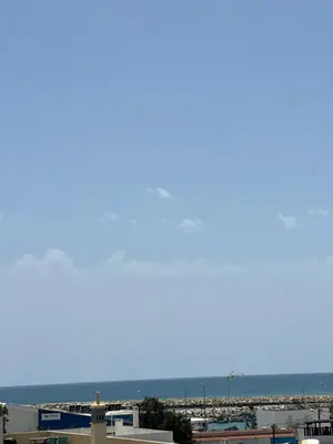 a view of the ocean from the roof of a building at Beach Holidays in Quarteira