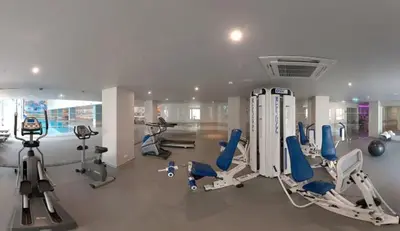 a gym with several exercise equipment in a room at Hotel Vila Galé Cerro Alagoa in Albufeira