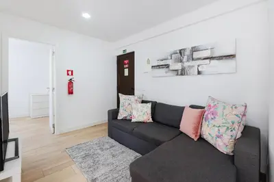 an alleyway with people walking down a street at Central Condo-Pool by Algarve Dream Holidays in Albufeira