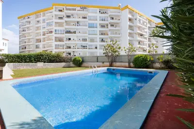 a swimming pool in front of a building at Central Condo-Pool by Algarve Dream Holidays in Albufeira