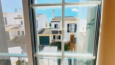 a view of a house from a window at Albufeira Home Paderne in Paderne