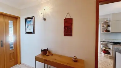 a kitchen with a wooden counter top on a wall at Albufeira Home Paderne in Paderne