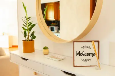 a dressing table with a mirror and a sign on it at Apartment Curitiba by Algarve Vacation in Albufeira
