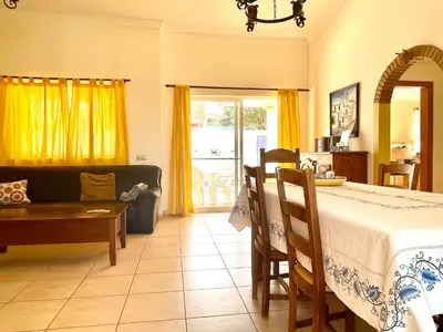 a living room with a bed and a couch at Villa Ana in Albufeira