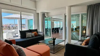 a living room with a couch and a table at Ocean Drive by Check-in Portugal in Albufeira