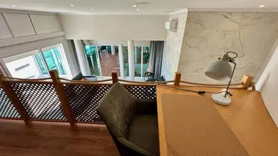 a living room with a couch and a lamp on a table at Ocean Drive by Check-in Portugal in Albufeira
