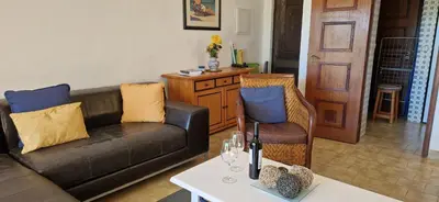 a living room with a couch and a table at Sao Rafael Village 2 Bedroom with a Pool in Albufeira