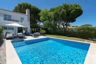 a swimming pool in front of a villa at Villa Celeste by SAPvillas in Vilamoura