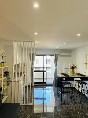 a dining room and kitchen with a table and chairs at Brand New Studio in Rua da Oura in Albufeira
