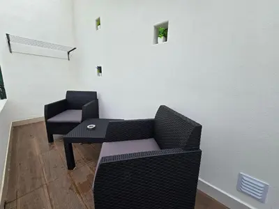 a white bathroom with a toilet and a sink at Modern Beach Apartment - Avenida Mar 2 - 150 mts da praia in Quarteira