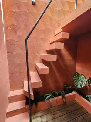 a set of stairs with potted plants on them at City Center Terrace in Faro
