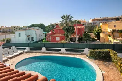 a large swimming pool on top of a house at Villa Rebelo in Albufeira