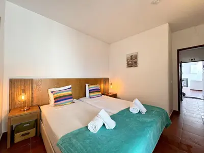 a living room with a table with food on it at Albufeira Ocean View III by Homing in Albufeira