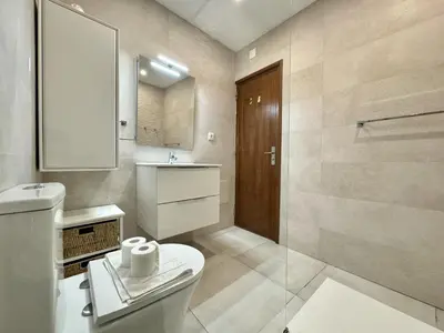 a small kitchen with a washing machine and a sink at Albufeira Ocean View III by Homing in Albufeira
