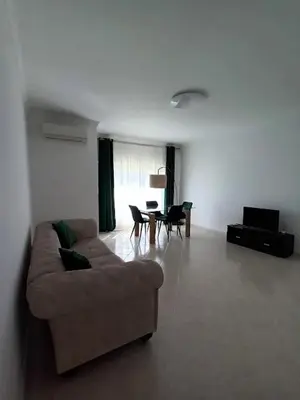 a living room with a couch and chairs and a table at T2 Faro in Faro