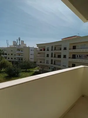 a balcony with a view of some buildings at T2 Faro in Faro