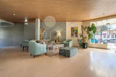 a living room with a couch and a table at NEW! Perfect Studio with Swimming Pool in Albufeira