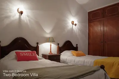 two beds in a room with two beds sidx sidx sidx at Akivillas Quarteira Relax in Quarteira