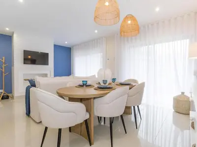 a dining room with a table and chairs at Apartment Pine Hills Reva Santuary Modern Elegance by Interhome in Vilamoura