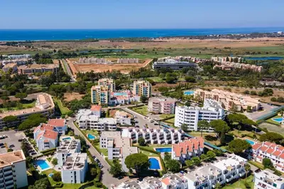 an aerial view of an apartment complex near the ocean at no22FM in Vilamoura