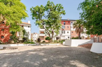 an empty parking lot in front of buildings at Casa Eden 2BR modern Apartment near Marina! Patio-Porch-WS-BBQ-FAST WIFI! in Quarteira