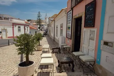 an empty street in front of a building at BnB Homes Apartments near Ocean & Lush Nature 500 m away from the ocean in Guia