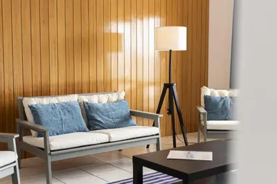 a living room with a couch and two chairs at Vila de Santa EulAlia III - Albufeira in Albufeira