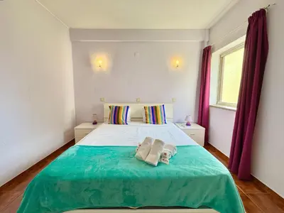 a bedroom with a bed with two towels on it at Vilamoura Central 10 by Homing in Vilamoura