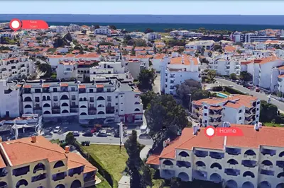 two men are flying in the air at #308 Marcilia Apartamento by Home Holidays in Albufeira
