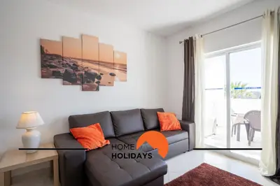 a living room with a couch and a window at #314 T2 Serenity by Home Holidays in Albufeira