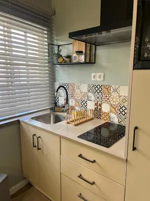 a kitchen with a sink and a counter top at casa da vila 33 in Faro