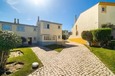 two beds sitting next to each other in a room at Ponta Grande Resort - Villa Maré in Albufeira