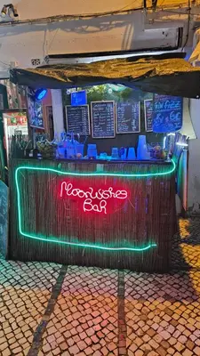 a bar with a sign that readsrared bar at Wonder Charm Guesthouse in Albufeira