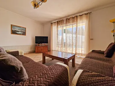 a living room with a couch and a coffee table at Villa Tio Pedro - Swimming Pool - For families- BY BEDZY in Albufeira
