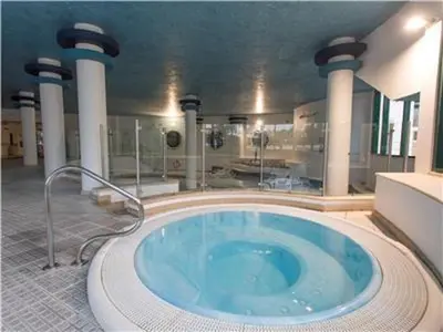a large bathroom with a large tub in a building at Amazing ApartHotel Apartments 2 Bedroom in Albufeira in Albufeira