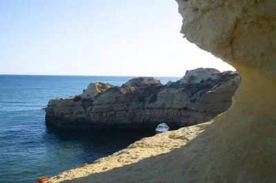 a cave in the rocks near the ocean at Apartamento de 2 quartos Hibiscus 40A na Praia de Sao Rafael - Albufeira, Algarve in Albufeira