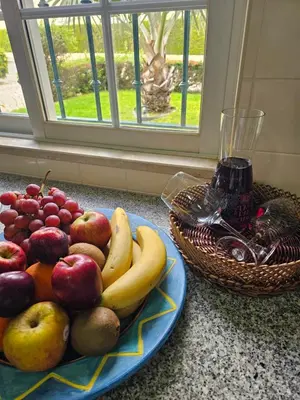 a plate of fruit on a counter next to a window at Vilamoura - VILLA LIMONI in Vilamoura