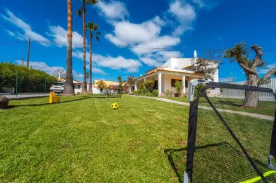a soccer ball in the yard of a house at Villa 4 Quartos, Piscina, AC, Jardim, Prestige For Home in Loulé
