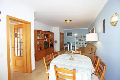 a kitchen and dining room with a table and chairs at A32 - Lancemar Flat in Albufeira in Albufeira