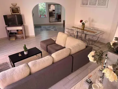 a living room with a couch and a table at Toiago in Vilamoura