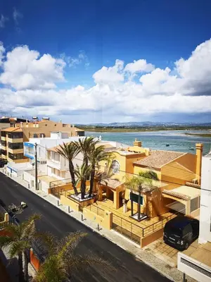 an aerial view of buildings and the water at Blife Paulya private apartment in Faro