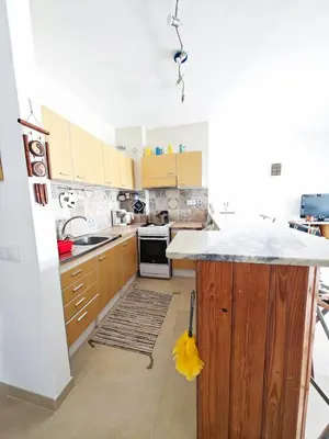 a kitchen with a counter top in a room at Blife Paulya private apartment in Faro