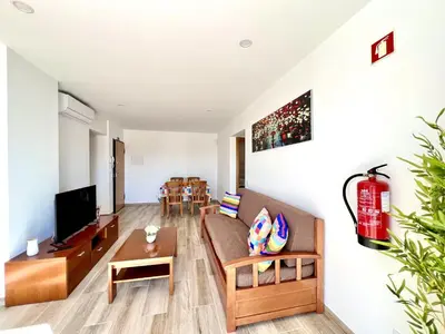 a living room with a couch and a tv at Vilamoura Design 2 by Homing in Vilamoura
