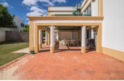 a brick patio with a pavilion in front of a house at Casa da Vigia - waking up in front of the sea in Albufeira